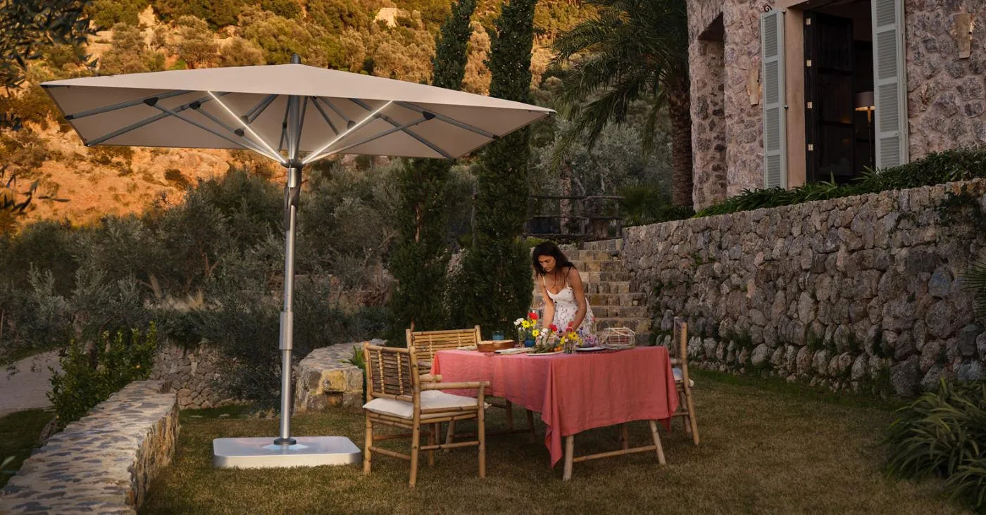 Fortello led centre pole umbrella on a terrace