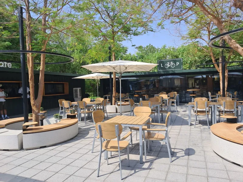 Fortino 2.4x2.4m umbrella with Ecru canopy installed over outdoor seating in Dubai